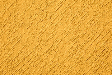 Yellow stucco wall, abstract background