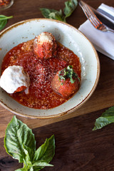Meatball sampling with burrata mozzarella, fresh basil, and crushed red pepper