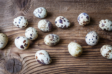 Quail eggs on a wooden board