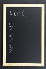 Space chalkboard background texture with wooden frame for notes and lists. blackboard space for wallpaper. Landscape mounting style vertical.
