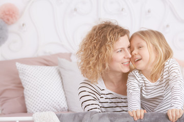 Mom and daughter laughing