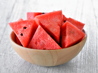 water melon in wood bowl on table
