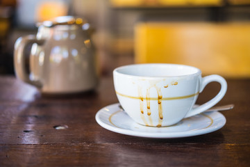 Empty coffee cup after drink on wood table
