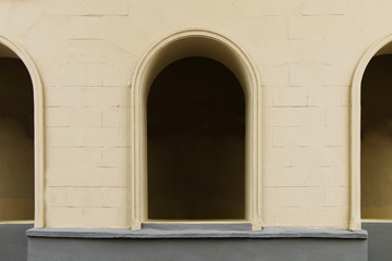 Decorative antique arches on the facade of the building