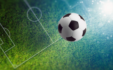 Soccer ball on green soccer field