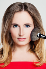 Smiling Woman with Make up  and Makeup Brush