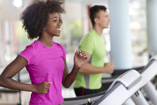 people exercisinng a cardio on treadmill