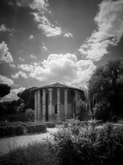 Temple of Hercules Victor, or Tempio Di Vesta with cloudy sky