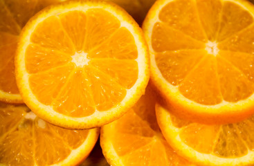 Background of sliced juicy oranges fruit