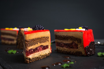 Chocolate cake on the rustic background. Shallow depth of field.