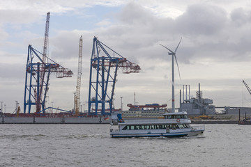 Boat of tourists goes on Elbe river in Hamburg, Germany