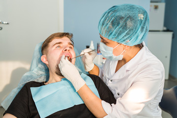 Dentist doing a dental treatment on a patient
