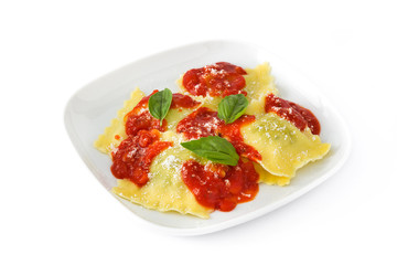 Ravioli with tomato sauce and basil isolated on white background

