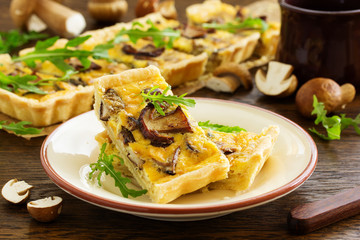Tart (Cake) with wild mushrooms. Selective focus.