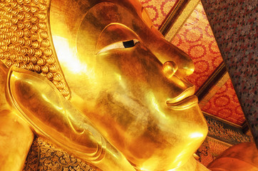 Reclining Buddha gold statue. Wat Pho, Bangkok, Thailand.