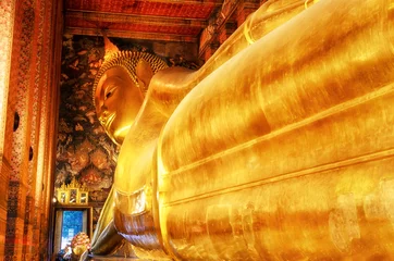 Zelfklevend Fotobehang Travel and vacation. Reclining Buddha gold statue. Wat Pho, Bangkok, Thailand. © KAL'VAN