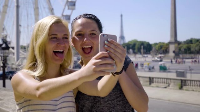 Happy Tourists Take Cute/Fun Selfies In Front Of Ferris Wheel, Eiffel Tower In Distance