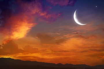 Generous Ramadan with mosque silhouettes . Ramadan background . Eid Mubarak background .Sunset and new moon .Paradise heaven