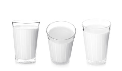 Glasses of fresh milk on white background