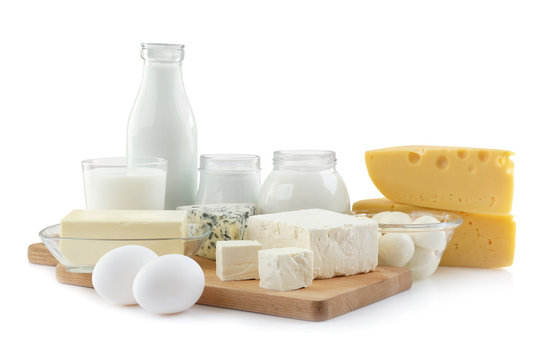 Assortment of fresh dairy products on white background
