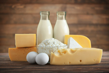 Different dairy products on wooden table