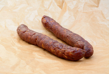 Delicious high quality smoked sausage on a crumpled paper