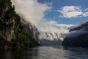 Fototapeta na wymiar clouds over Geirangerfjord in Norway