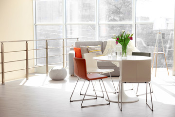 Modern living room with table and chairs