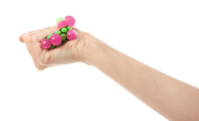 Female hand with stress ball on white background
