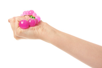 Female hand with stress ball on white background