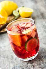 Sangria drink in glass on wooden table
