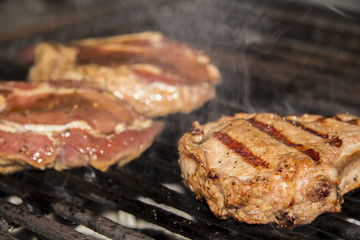 Delicious chuck steaks on the grill.