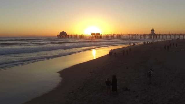 Sun is nearly set behing the pier