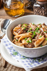 Pasta penne with pork sauce.