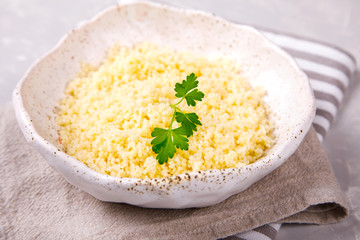 Couscous with parsley in the bowl..Concept of Healthy Food.Food or Healthy diet concept.Super Food.Vegetarian.Copy space for Text.
