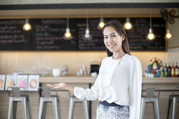 Young Asian small business owner at restuarant, startup SME with woman working concept, 20-30 year old.