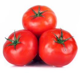 .three sweet tomato red with bright green steam with white light and the water drops , isolated on white background