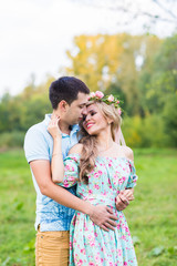beautiful young couple hugging in the park