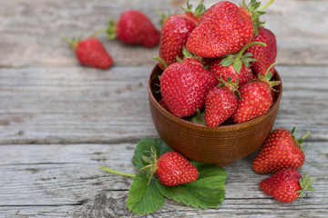 Fresh Ripe Strawberries in Wooden Bowl.