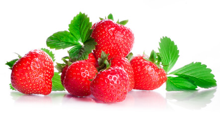Sweet berries of a strawberry red fragrant with green leaflets isolated on a white background.