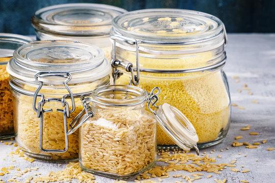 Assorted Cereals And Grains In Glass Jars For Storage, Selective Focus