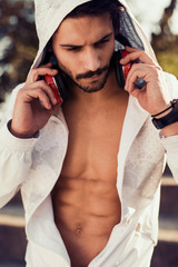 Young man listening to music on a smart phone