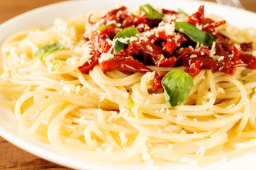 Italian dish - pasta with sundried tomato and basil