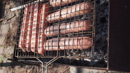Grilled sausages, cooked on the grill. Barbecue. Still life.