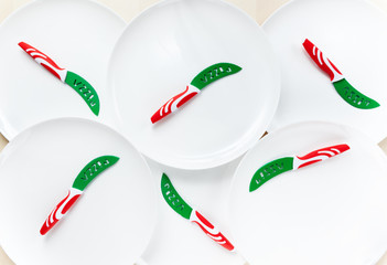 empty White plates with knives for pizza. Background for restaurants or pizza delivery sites