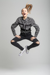 Young pretty girl jumping high