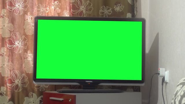Dolly Move Into a Big Screen TV With Greenscreen.
