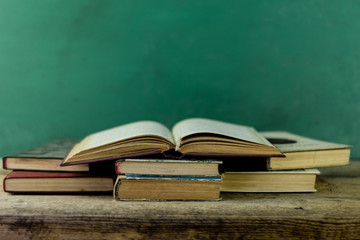 Books on an old wooden table