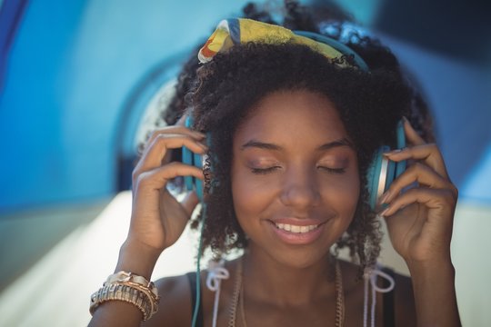 Close up of woman listening music