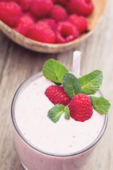 Raspberry milk shake with mint decor.